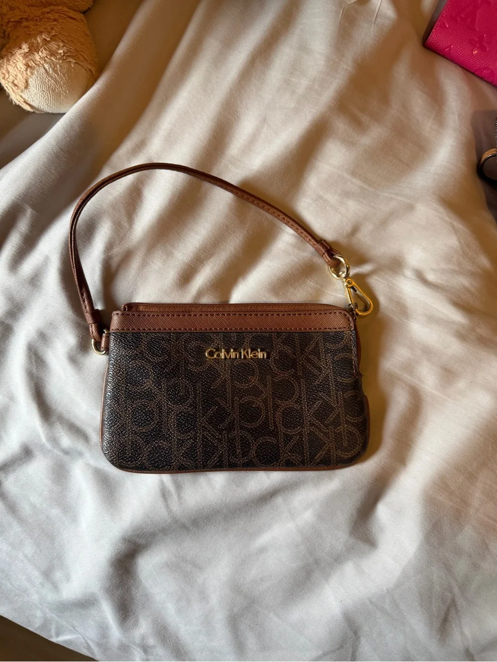 Calvin Klein Brown Monogram Wristlet with Gold Hardware